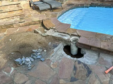 Flagstone pool deck repair around the skimmer