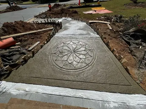 Stamped concrete walkway with a medallion pattern