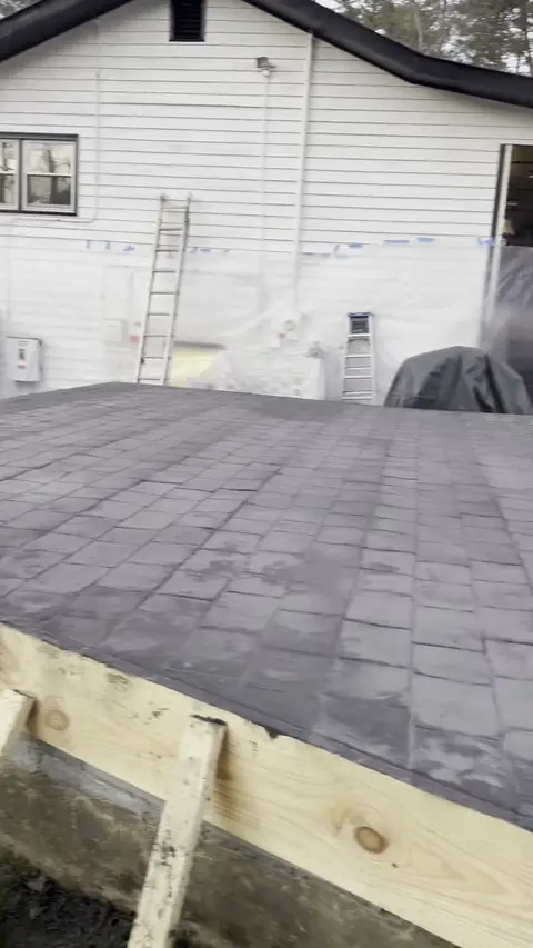 Crew stamping a concrete patio